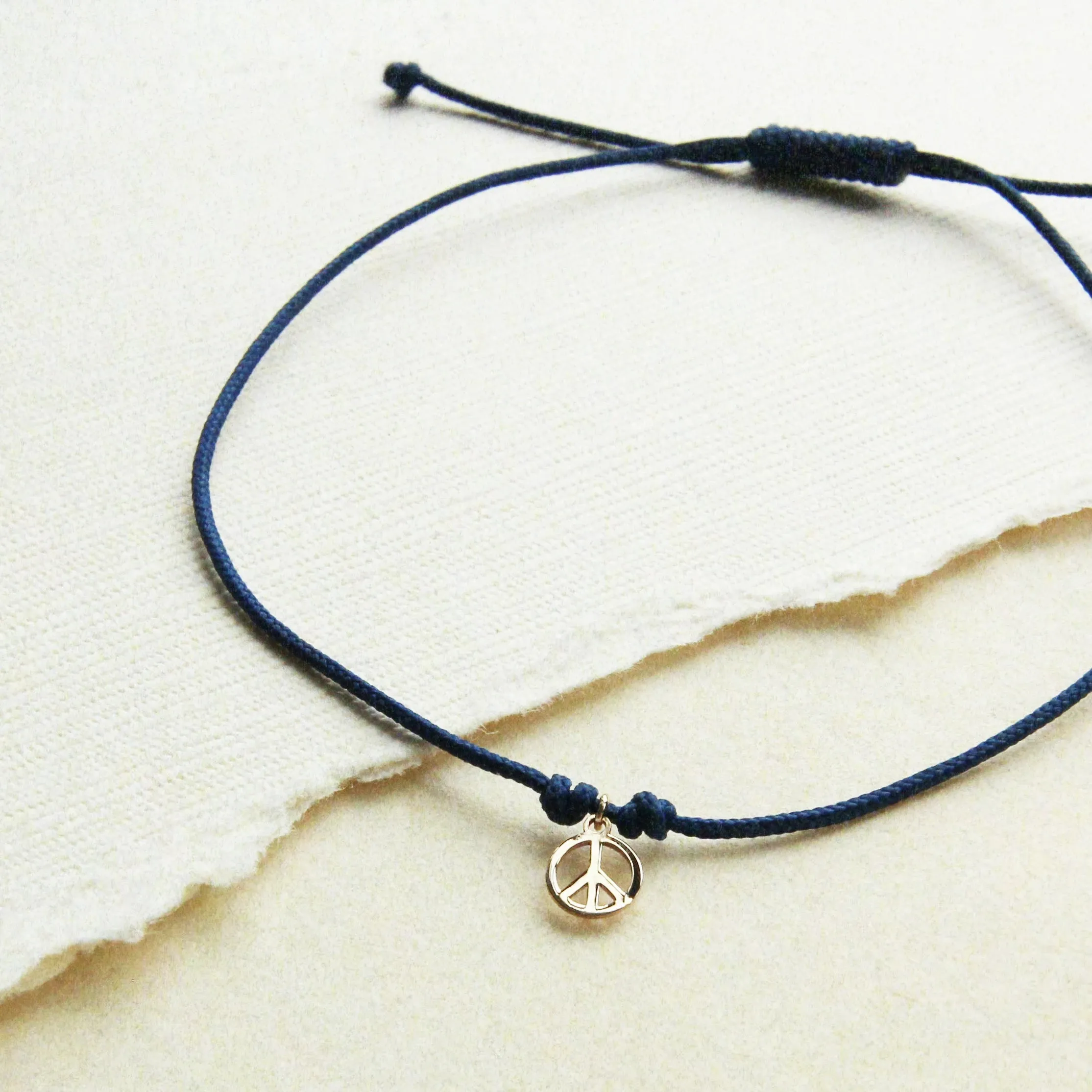 the tie dye moonchild contemplation cord bracelet - 10k yellow gold, blue cord